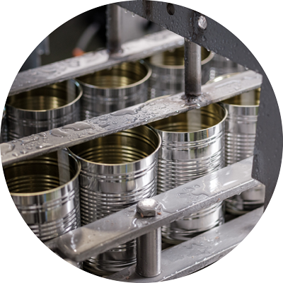 Empty tins that are being filled with food.