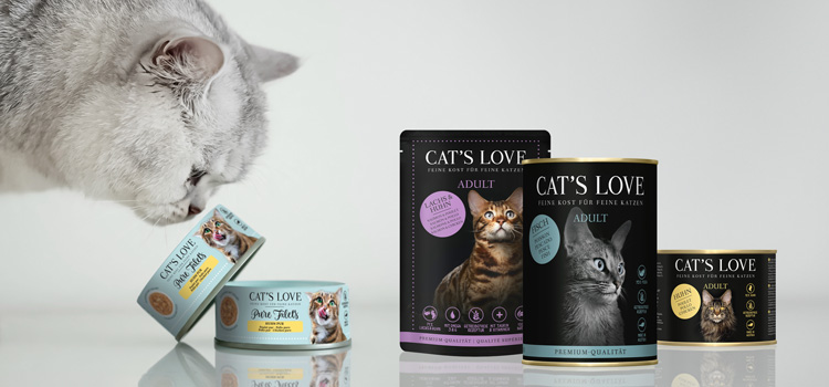 A cat smelling CAT'S LOVE fillets and CAT'S LOVE products next to it.